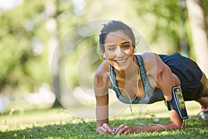 Im doing it for my health. a beautiful young woman exercising outdoors on a sunny day.