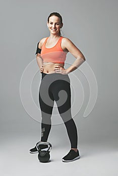 Im feeling good about myself. Studio portrait of an athletic young woman standing with her hands on her hips against a