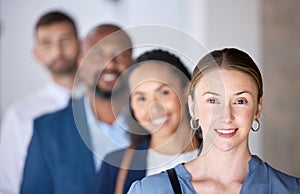 Im first in line. Shot of a group of businesspeople standing in a line at an office.