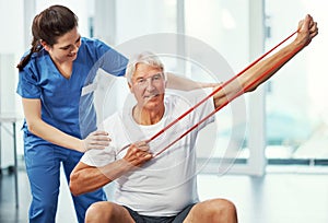 Im on that fitness bandwagon. Cropped portrait of a senior man working on his recovery with a female physiotherapist.