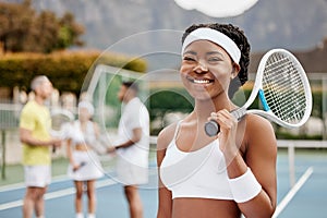 Im game ready. Cropped portrait of an attractive young female tennis player standing outside on the court with her coach