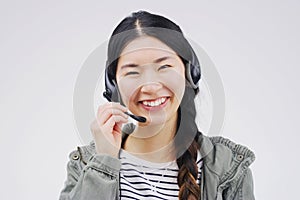 Im glad I could help. Studio portrait of an attractive young female customer service representative wearing a headset