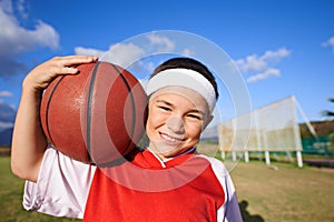 Im gonna be the next WNBA superstar. Portrait of a young girl holding a basketball. photo