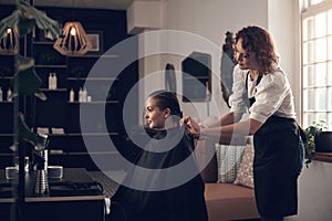 Im so grateful to be in your capable hands. a little girl getting her hair done at the salon.