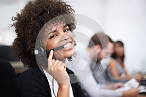 Im always happy to help. Portrait of an attractive young female call center operator.