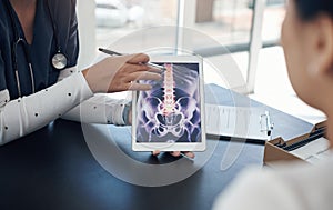 Im here to educate you on all things health. a young female doctor showing a patient a digital x-ray in an office.