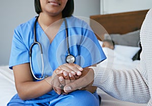 Im here to help you through this. Shot of a nurse comforting a man at home.