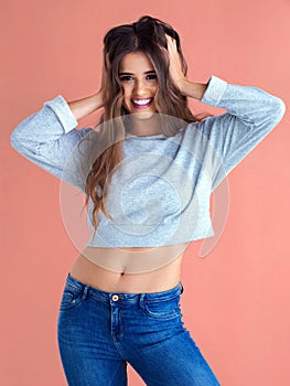 Im just being myself and thats beautiful. Studio shot of a beautiful young woman posing against a pink background.