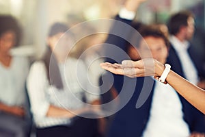 Im open for questions. businesspeople hands raised asking questions during a seminar.