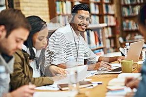 Im prepping for finals. Cropped portrait of a young male university student studying at a table in the library.
