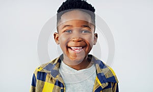 Im always ready to have some fun. Portrait of an adorable little boy posing against a white background.