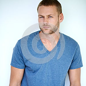 Im serious about my style. Studio shot of a handsome young man posing against a white background.