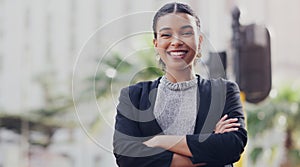 Im slowly taking over this city. Cropped portrait of an attractive young businesswoman smiling while standing with her