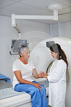 Im sure we sont find anything...a senior woman being comforted by a doctor before and MRI scan.