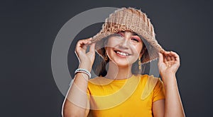 Im winter ready. Cropped portrait of an attractive teenage girl wearing a beanie and feeling playful against a dark