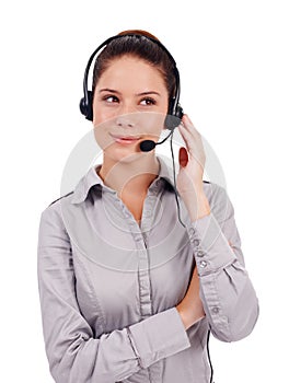 Im at your service. a young customer service representative wearing a headset isolated on white.