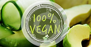 Image of 100 percent vegan text banner against close up of vegetables