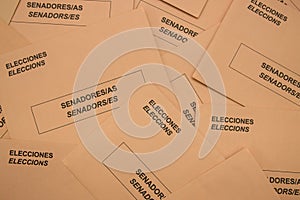 Image from above of a table full of electoral envelopes for the senate in Spain