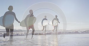 Image of african american couple over african american couple with surfboards at beach