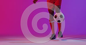 Image of african american male soccer player over shapes