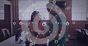 Image of ai icons and data processing over diverse business people in office