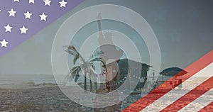 Image of american flag revealing statue of liberty and beach bar