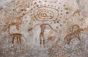 Image of an ancient man on a cave wall.