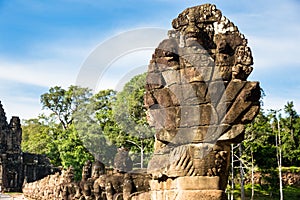 Image in Angkor Wat complex temple. Decorated bridge with warrios guardian and naga serpent.