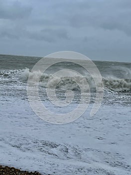 Waves slamming into a beach photo