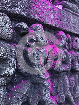 Image of an anicent sclupture on a wall of stone photo