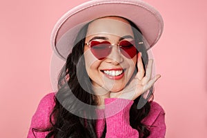 Image of asian girl with long dark hair wearing hat and sunglasses smiling