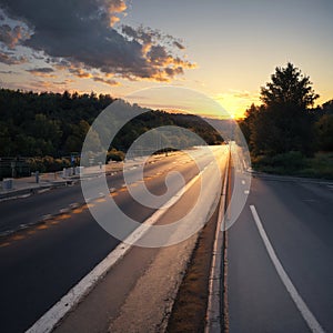 an asphalt highway road and sky sunset clouds.