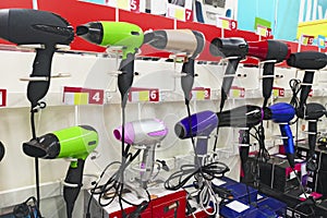 Image of assortment of different hair dryers at household appliances shop