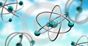 Image of atom models spinning on blue background