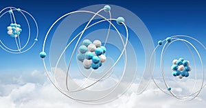 Image of atom models spinning over clouds on blue background