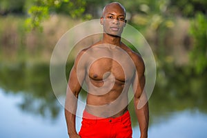 Image of an attractive young fitness model posing outdoors in the park