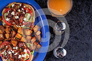 Image of avocado bacon toast with cucumber, tomato and cheese.