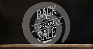Image of back to school sale text over blackboard background