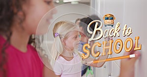 Image of back to school text over diverse school children in classroom