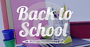 Image of back to school text over school items