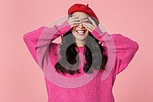 Image of beautiful asian girl smiling and covering her eyes with hands