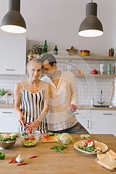 Image of beautiful couple in love preparing breakfast