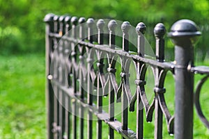 Image of a Beautiful decorative cast iron wrought fence with artistic forging.