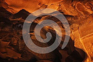 image of beautiful golden light through the cave entrance photo