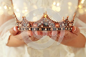 image of beautiful lady with white lace dress holding diamond crown. fantasy medieval period.