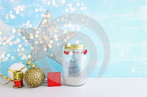 Image of beautiful mason jar with christmas tree and holiday decorations