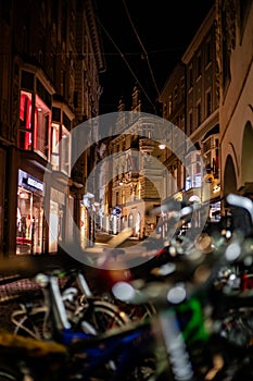 Image with bikes infront out of focus and old archicture building ancient at night