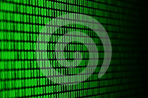 An image of a binary code made up of a set of green digits on a black background