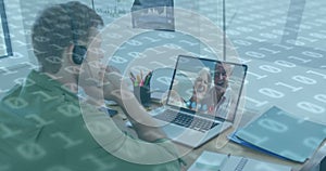 Image of binary coding numbers changing over man using laptop on image call in background