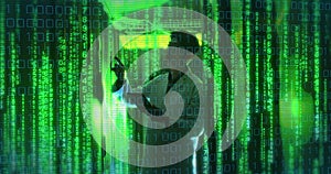 Image of binary coding over asian man by computer servers